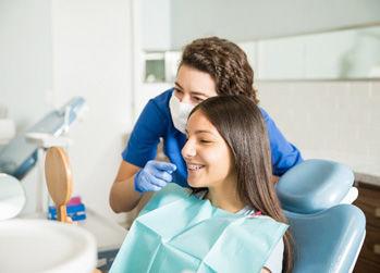 Teen smiling at the dentist with braces