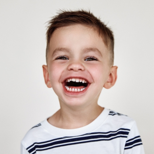 Child brushing teeth to prevent dental emergencies