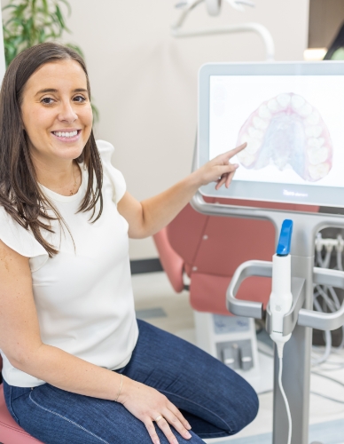 Orthodontist looking at digital smile impressions