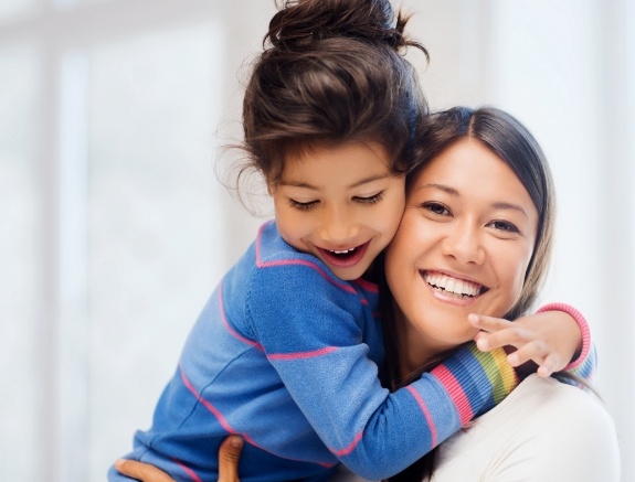 mother and child smiling
