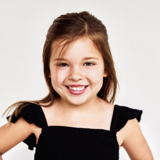 Preteen girl with traditional orthodontics