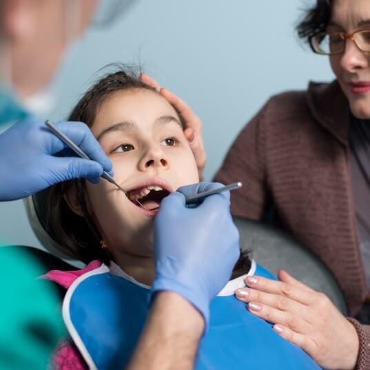 Child receiving treatment during orthodontic emergency