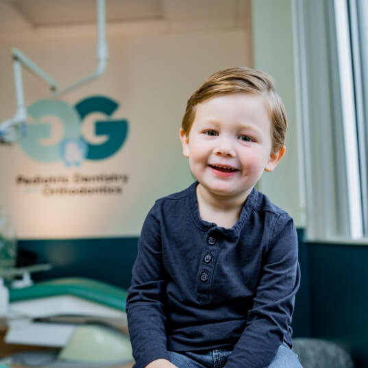 Child smiling after pediatric preventive dentistry checkup and teeth cleaning visit