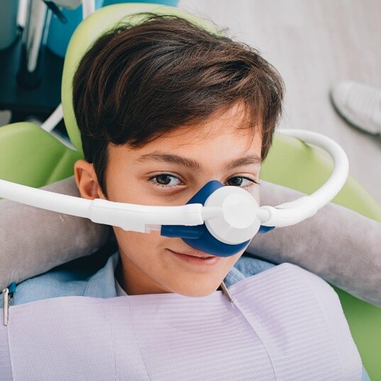 Child receiving nitrous oxide sedation dentistry