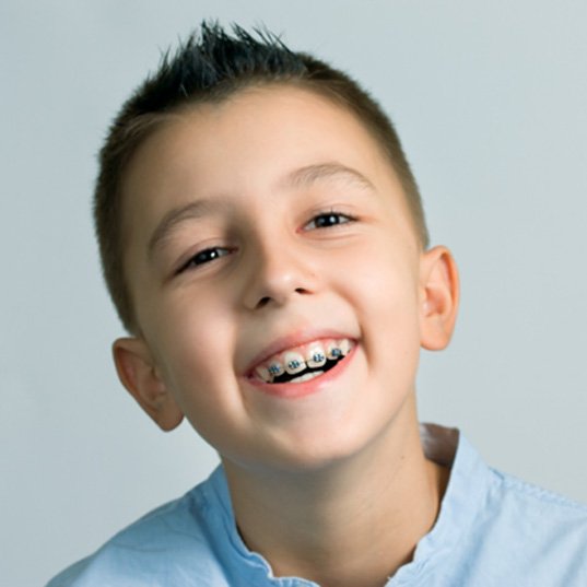 : a boy smiling with braces in Naperville