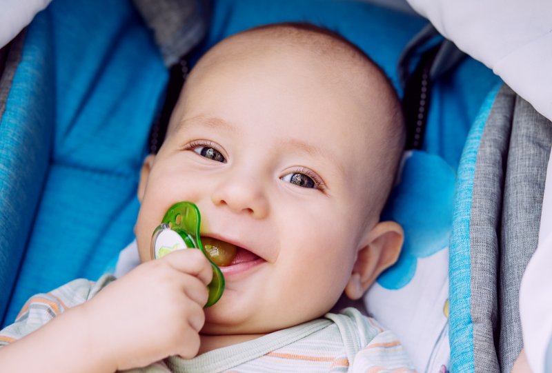 a baby with its pacifier