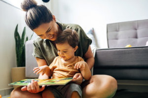 a child and their parent reading a book